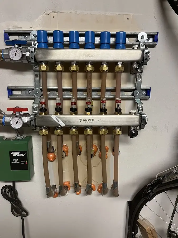 Plumber performing Gas Line Installation at a residential property in Copake